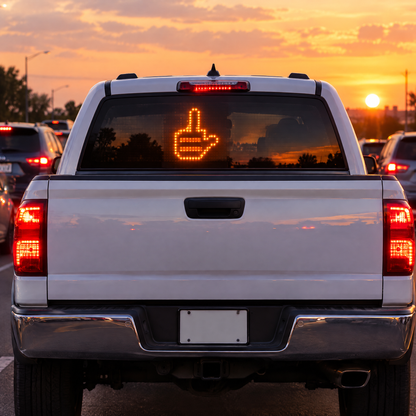Gesture glowing in a pickup truck rear window at sunset